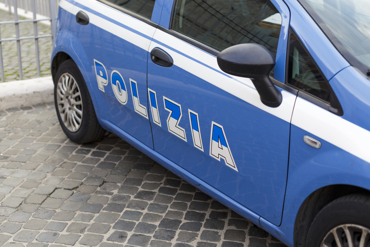 Close up of an Italian blue police car with inscription Polizia (police)