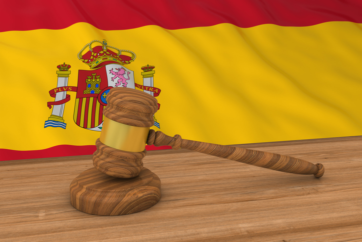 panish Law Concept - Flag of Spain Behind Judge's Gavel