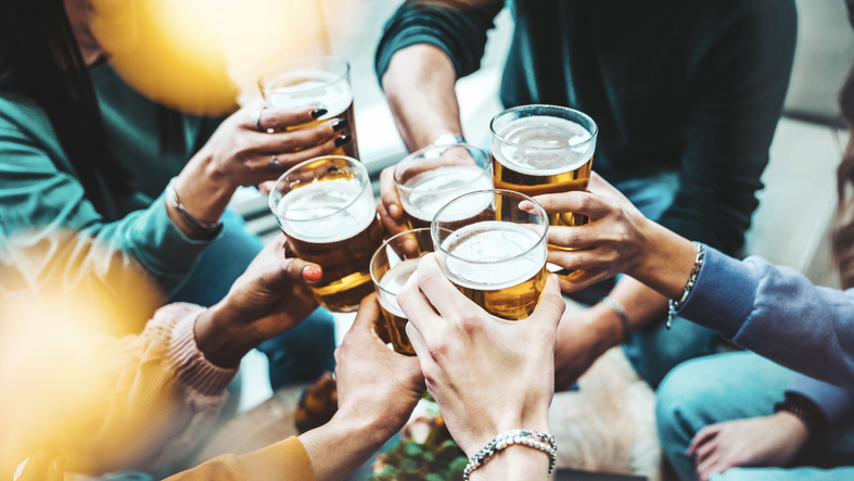 Group of people drinking beer at brewery pub restaurant