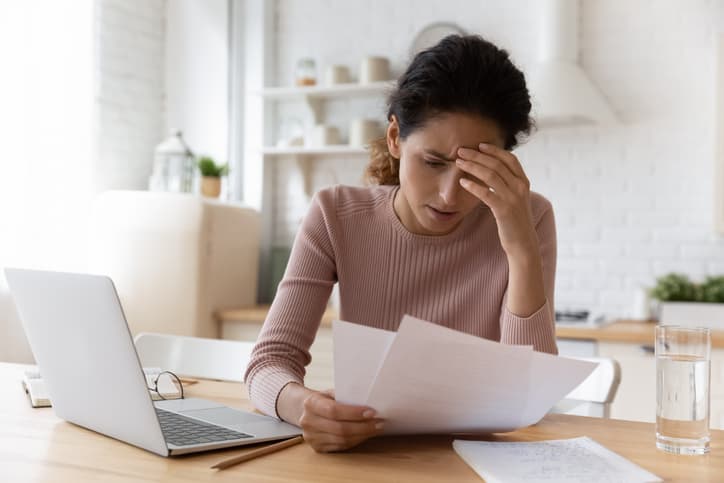 Unhappy woman reading bad news